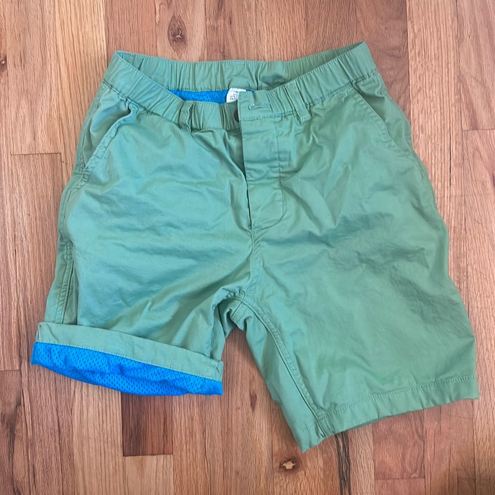 Woof brand, size small, green shorts with blue mesh lining, button fly